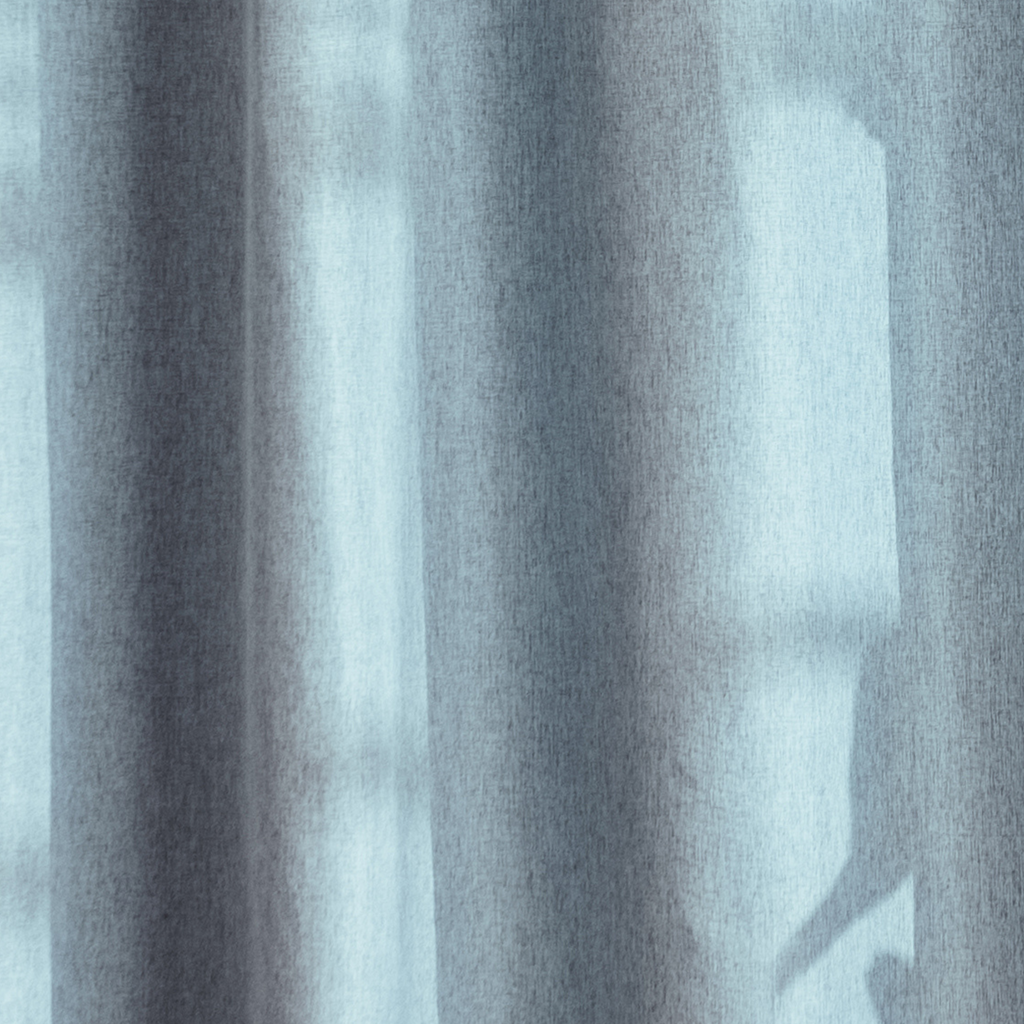 Weighted lower hem holding the blue panel in an even straight fall