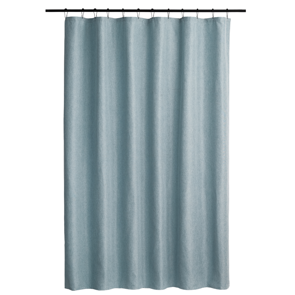 Powder blue curtain styled in a calm bathroom with warm daylight