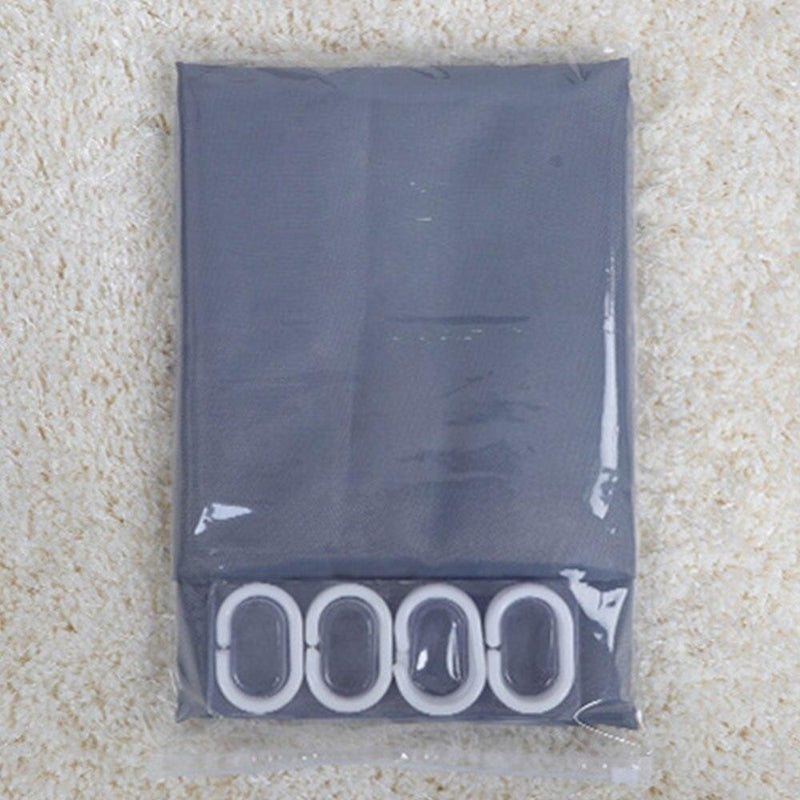 Full length grey curtain hanging straight beside a white bathtub