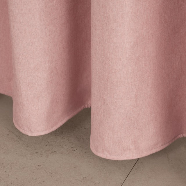 Weighted lower hem keeping the solid pink panel hanging straight