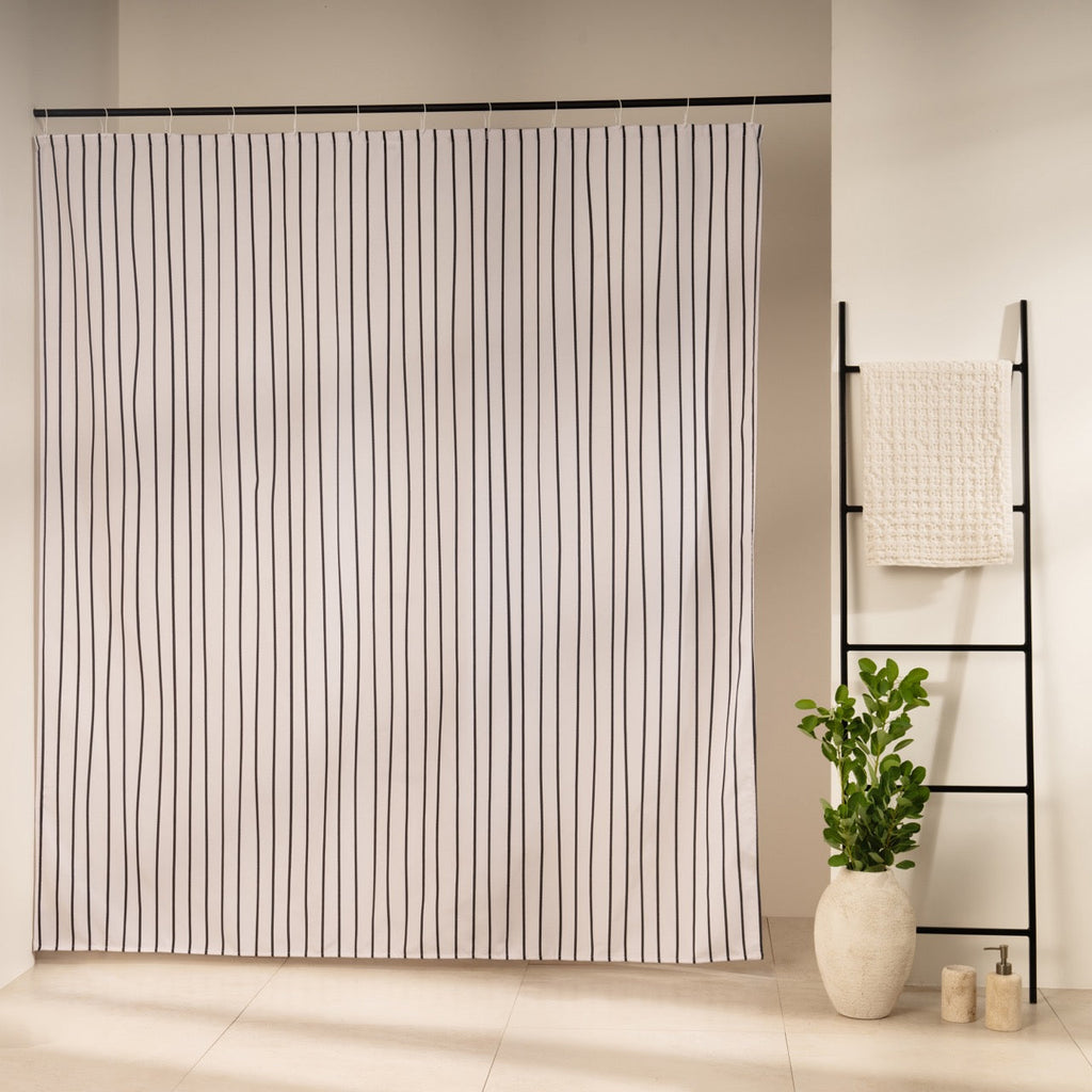 Fine even black stripes running vertically on an off-white panel