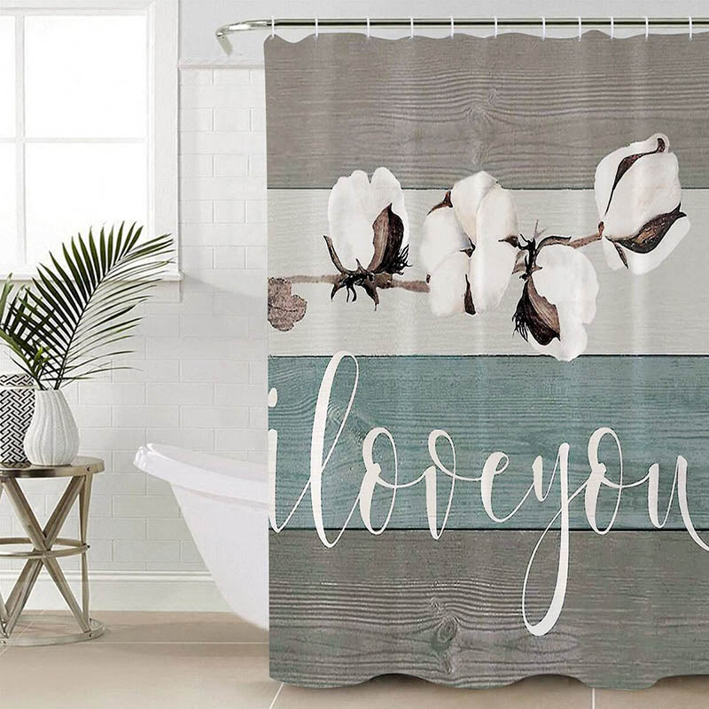 Branch of white cotton flowers on horizontal taupe and beige wood planks