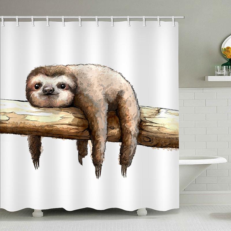 Close view of the painted sloth face and branch on white fabric