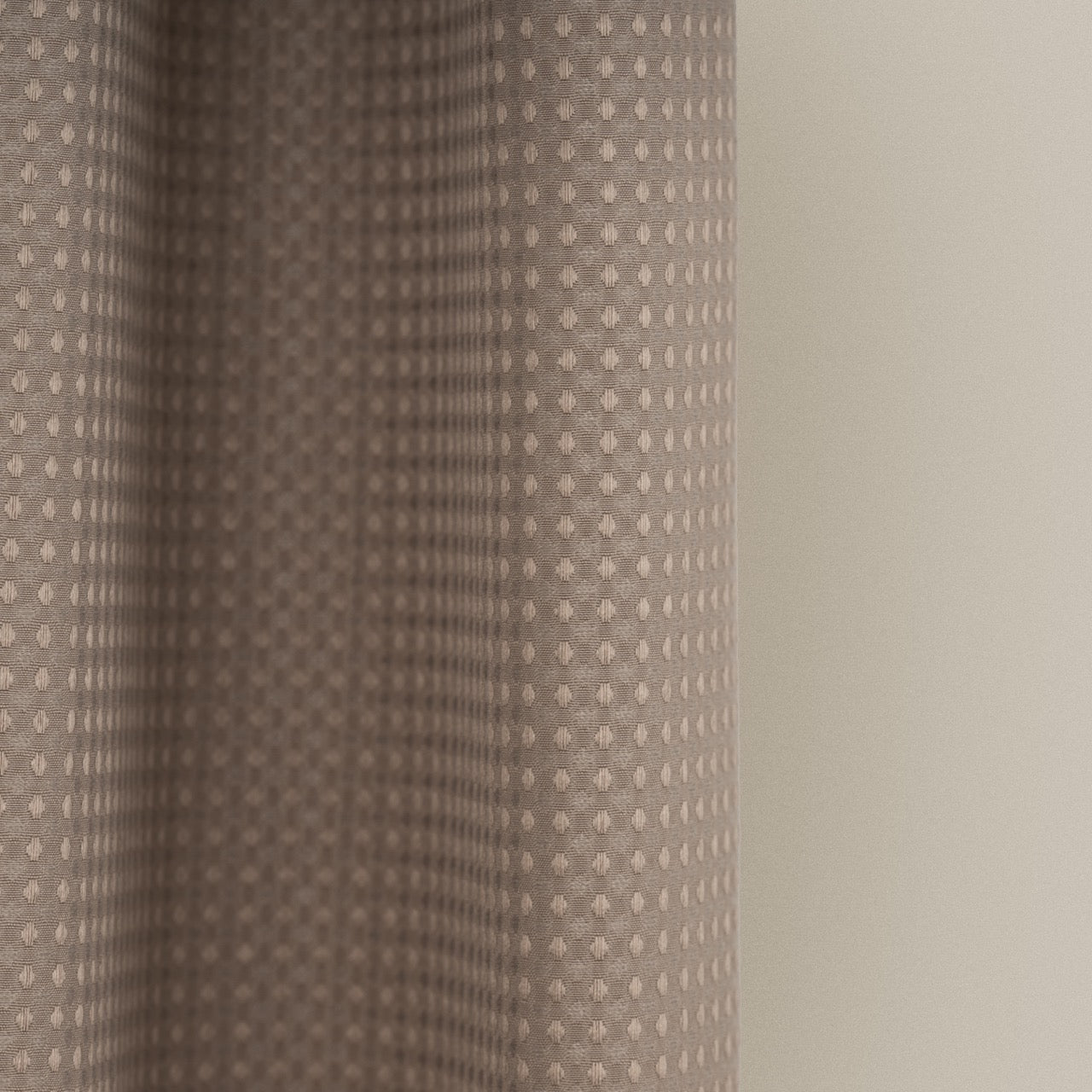 Full length mocha curtain hanging beside a glass shower screen