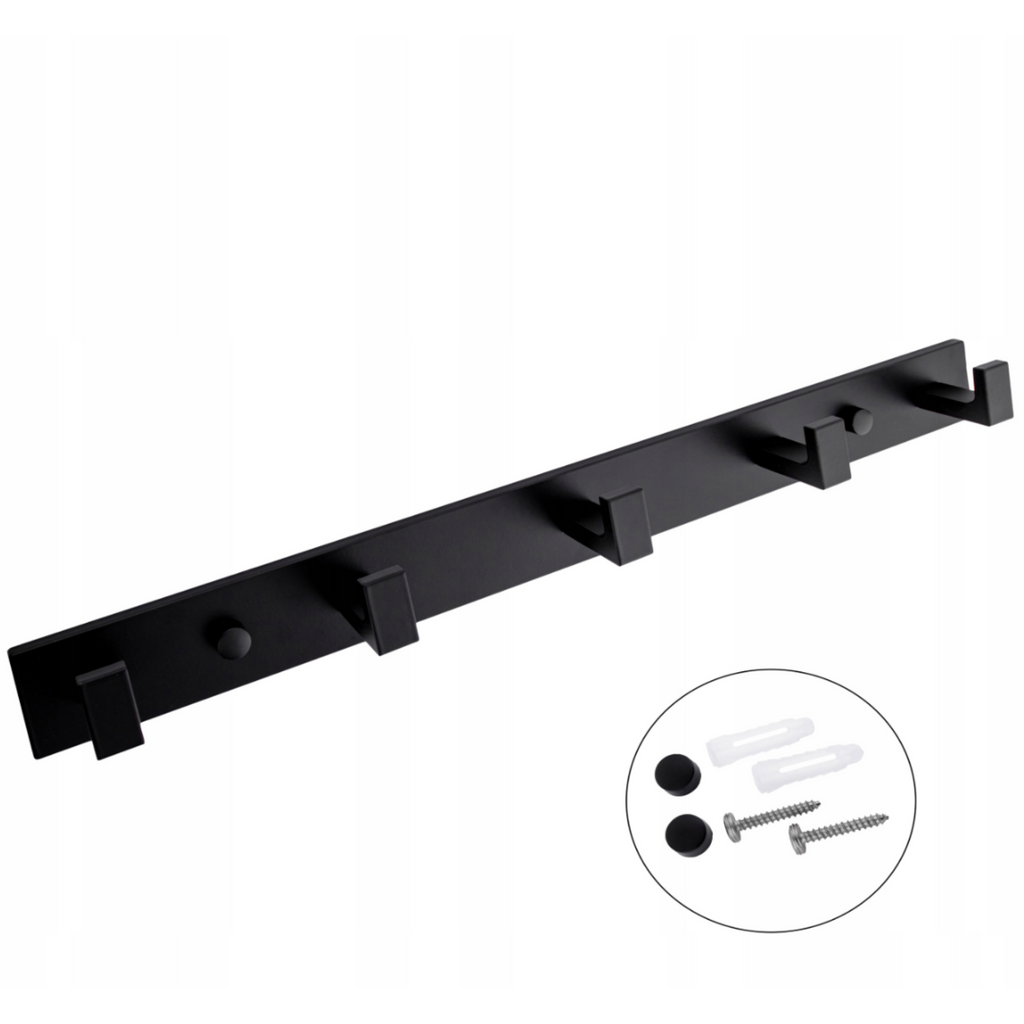 Black towel rail styled in a modern bathroom with pale tiling