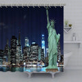 Statue of Liberty before a lit Manhattan skyline mirrored in dark water