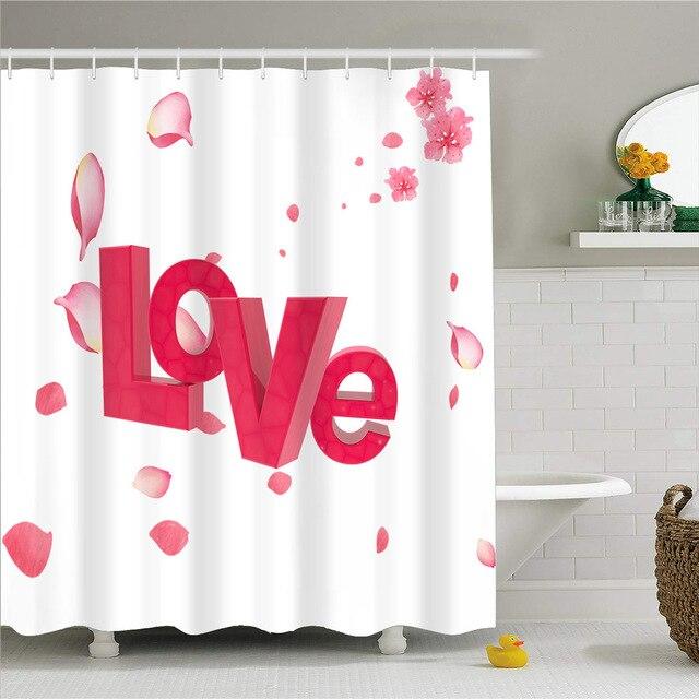 The word LOVE in raspberry pink surrounded by falling pink rose petals