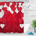 Cut paper heart garlands hanging above a warm red bokeh background