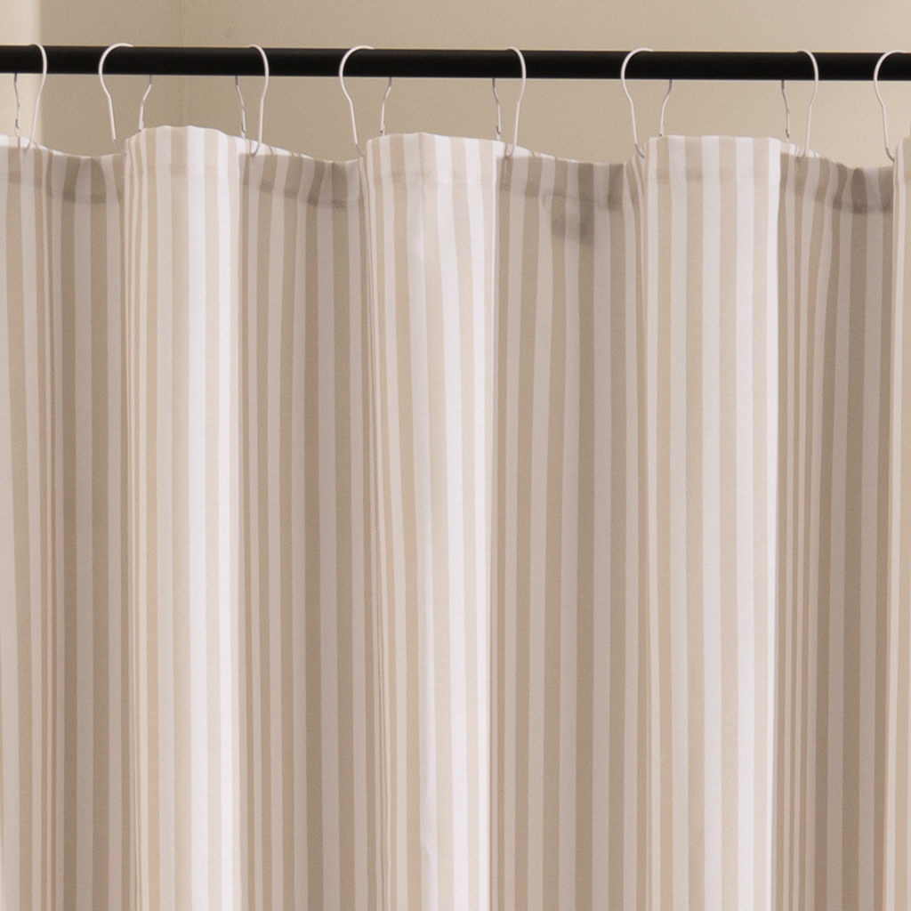 Close detail of the beige stripe edges on the woven white cloth
