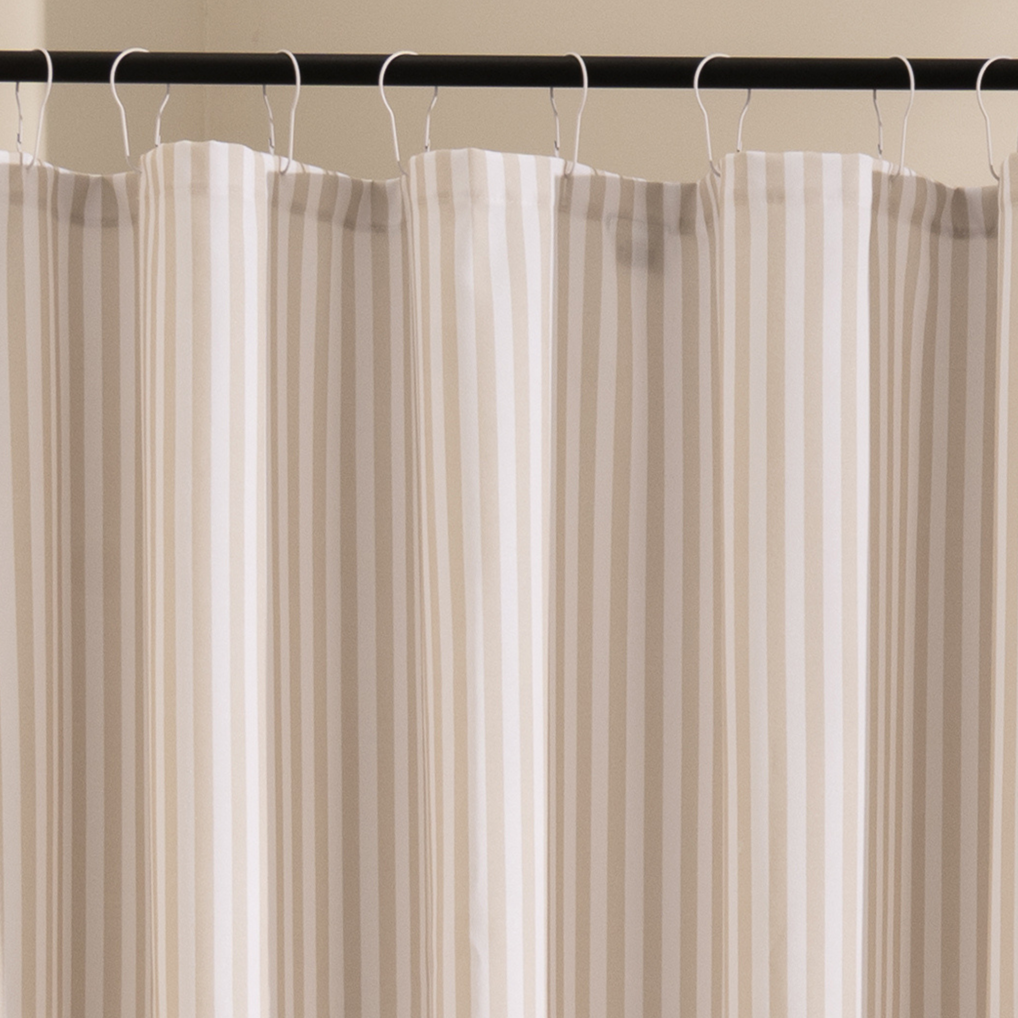 Close detail of the beige stripe edges on the woven white cloth
