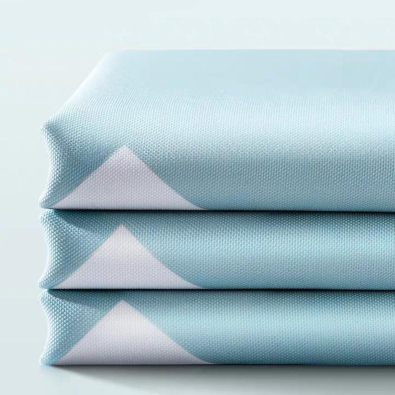 Full length blue triangle curtain hanging straight beside a walk in shower