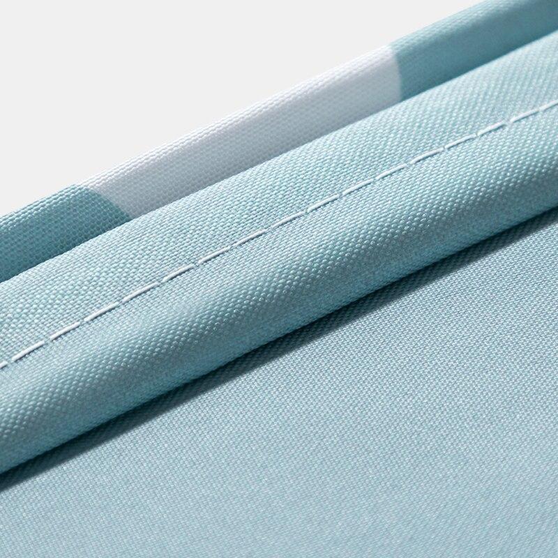 Fabric texture detail showing the fine weave behind the triangle print