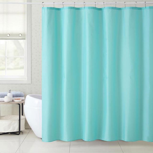 Plain aqua cloth curtain with visible textile grain and a soft flowing fall