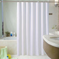 Plain white curtain panel hanging in an even fall with no pattern