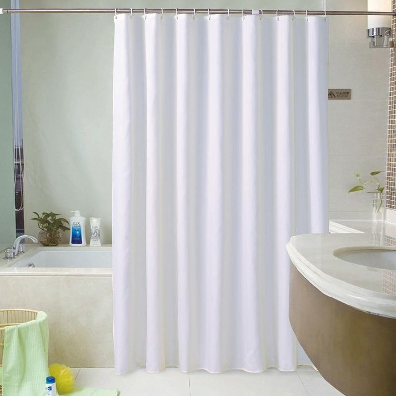 Plain white curtain panel hanging in an even fall with no pattern