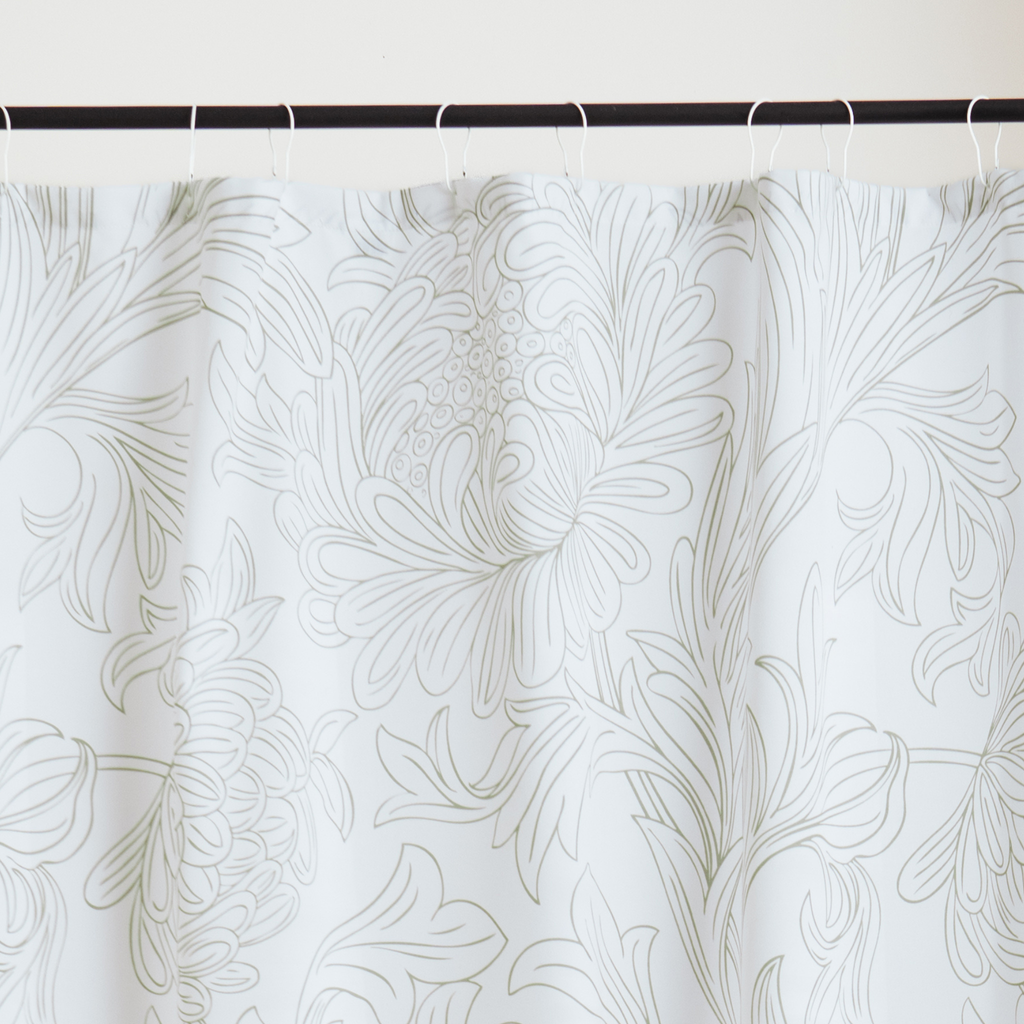 Close detail of the raised white floral catching soft raking light