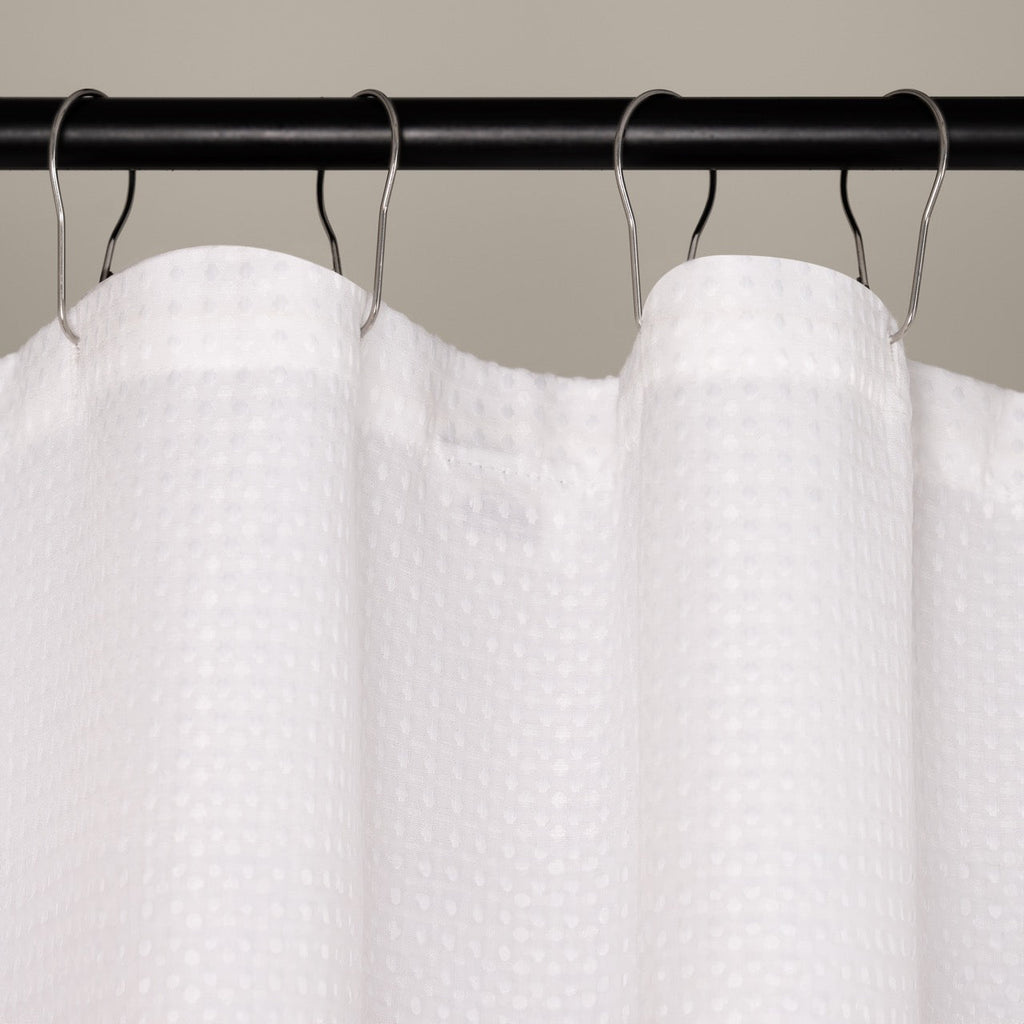 Pure white waffle panel hanging in a bright modern bathroom